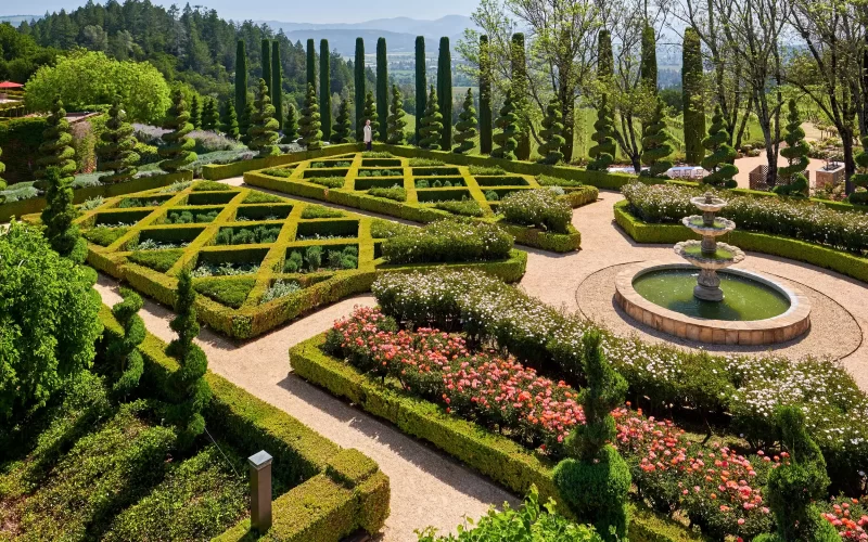 A beautiful landscape in front of a mansion house.